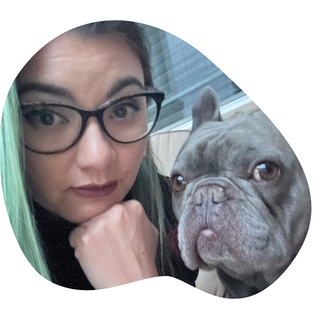 A pet owner with a her grey French Bulldog