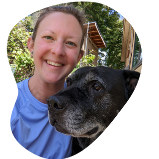 A pet owner with her black dog